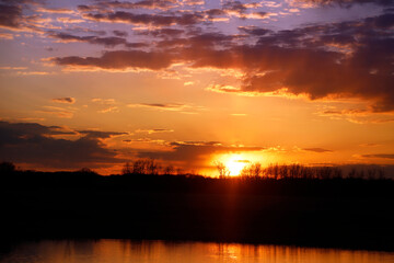 Fototapeta na wymiar Sunset over a pond Bottineau ND