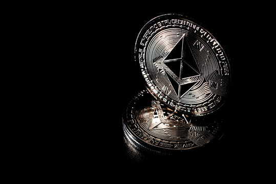 Ethereum metal physical currency concept. Cryptocurrency concepts on black background.
