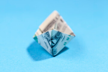 paper boat made of one american dollar