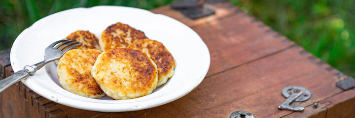 syrniki sweet pancakes cottage cheese breakfast outdoor meal snack on the table copy space food background rustic top view 
