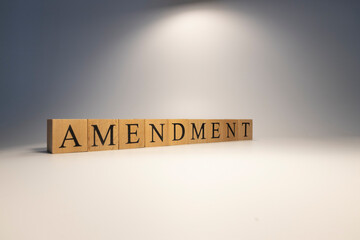 Amendment was created from wooden cubes. News and journalism concepts.