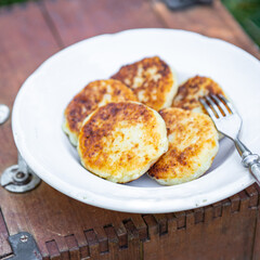 syrniki sweet pancakes cottage cheese breakfast outdoor meal snack on the table copy space food background rustic top view 