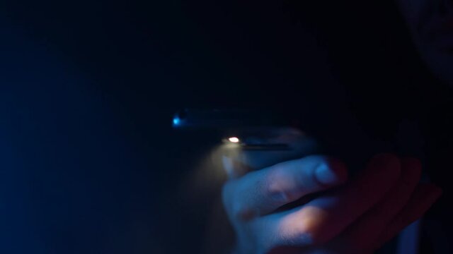 Using The LED Flashlight of a Smartphone In Darkness