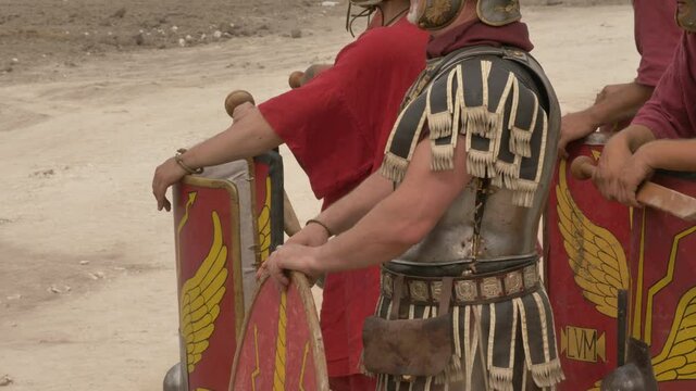 A warriors stand in line waiting for the battle The details of the ammunition of the Roman soldiers in the foreground is their Centurion.