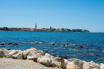 The historic medieval coastal town of Porec in Istria, Croatia, seen from the shore just north of...