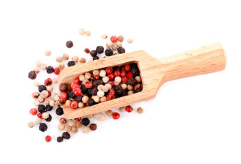 Close up of Mixted multi coloured peppercorns. white, black and green peppercorns  on wood spoon.
