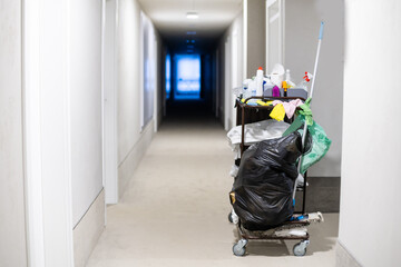 Cleaners trolley with cleaning equipments at hotel