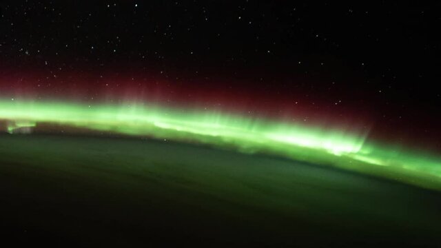 Real sunrise view from space, satellite view time lapse with green aurora borealis. Images furnished by Nasa