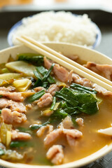 angle view fast food of spicy boiled pork with rice vertical composition