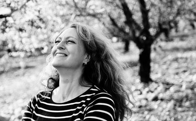 Outdoor portrait of happy smiling woman