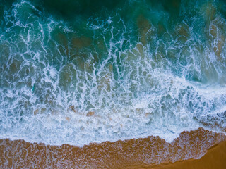 Scene of Beautiful sea waves. Aerial view of drone. Beach sand and sea copy space area. Summer sunset seascape. Phuket Thailand Beach. Water texture. Top view beach sea. Nature and travel concept.