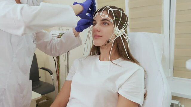 Patient brain testing using encephalography at medical center
