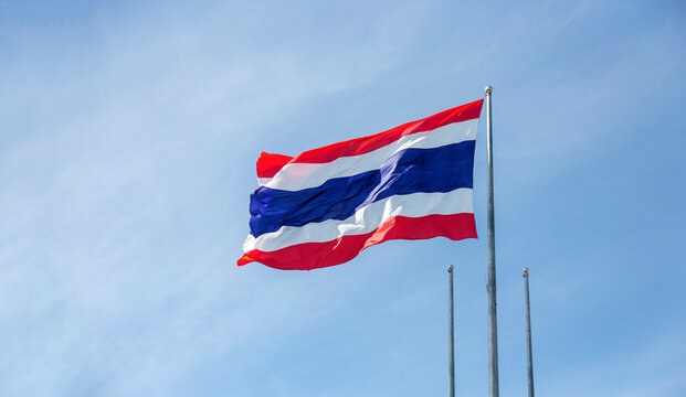 Thai flag on sky windy day for asia national sign