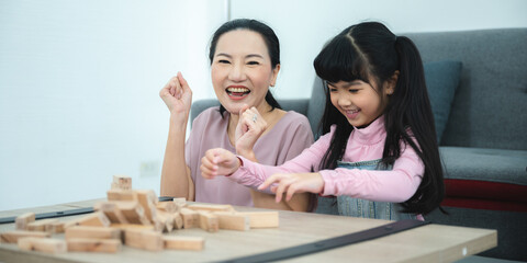 children development education, mother and daughter family playing and learning fun at home, young woman and eltern teacher are happy smiling together, little cute girl childhood concept