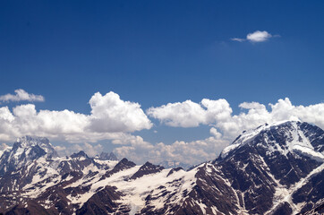 Naklejka premium Snow-capped peaks of the Caucasus Mountains in Russia.Glacier at an altitude of 3800m.