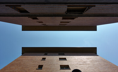 Low angle view of two buildings making the equal symbol