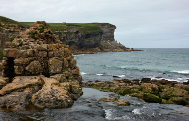 stones in coastline between mountains of Cantabria spain