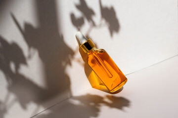 Unbranded bottles in mockup style with shadow top view. Tube of eye oil on a white background....