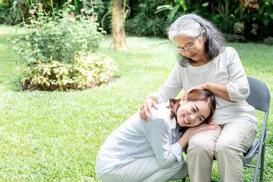 Portrait images of Asian elderly mother and daughter, are smile with happiness in the park, to relationship in family and mother's day concept.