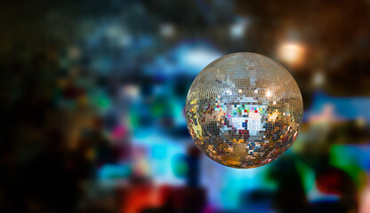 Party disco mirror ball reflecting colorful  lights 