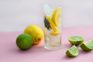 lime cocktail with lime and lemon on a bright background