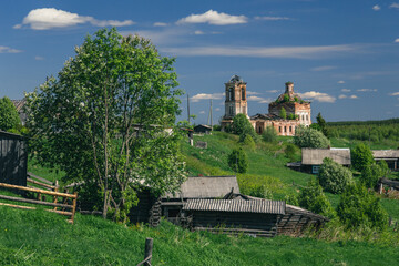 beautiful rural summer landscape. Houses and orthodox church. Summer village day, Russia