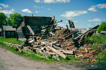 Wooden boards and rubble and the ruins of the house, completely destroyed