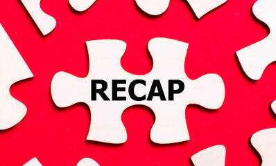 On a bright red background, white puzzles. In one of the pieces of the puzzle, the text RECAP