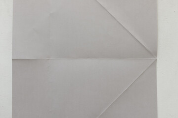 gray paper folded then flattened background