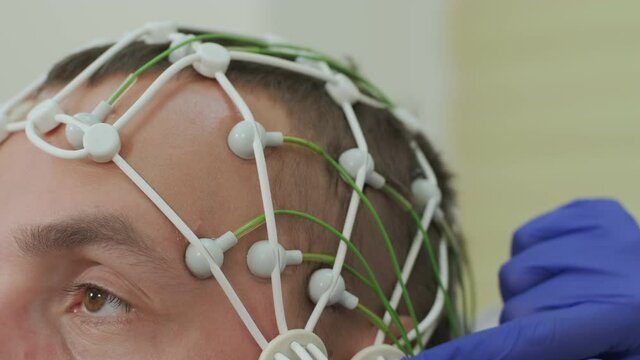 Patient brain testing using encephalography at medical center