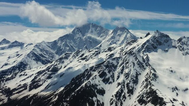 Aerial View from an drone of Beautiful Snowy Caucasus Mountain Landscape in Winter.Flight above Snowcapped mountains