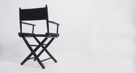 Sight Back of black director chair use in video production or movie industry on white background.