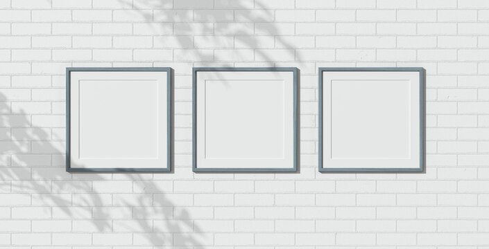 Three wooden frames on white brick wall. Triptych. 3D render wooden frame mock up. Empty interior. 3D design interior. Template for business. Passe partout frame. Blank. Shadow on the brick wall.
