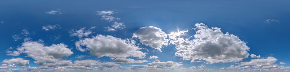 hdri 360 panorama of blue sky with white beautiful clouds. Seamless panorama with zenith for use in...