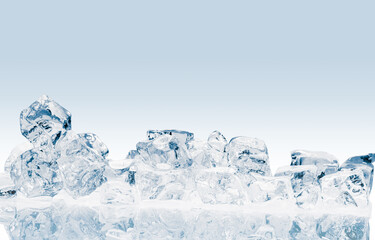 The heap of shiny natural ice cubes on a white reflective surface.