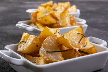 bowl of rustic fried and roasted potatoes with rosemary