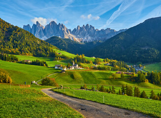 Fototapeta na wymiar Famous best alpine place of the world, Santa Maddalena village with magical Dolomites mountains in background, Val di Funes valley