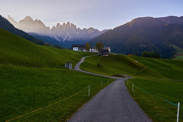 Dramatic morning. Countryside view of the St. Magdalena or Santa Maddalena in the National Park Puez Odle or Geisler summits. Location Bolzano, Italy.