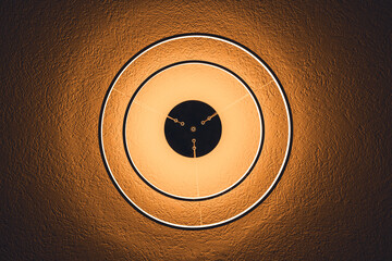 Round led lamp on the ceiling with yellow  golden light