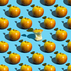 Seamless pattern with whole and bitten apples on blue background.
