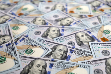 Hundred US dollars bills, selective focus. Paper currency for background, concept of american and global economy, exchange rate