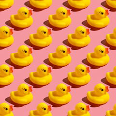 Seamless pattern with rubber duck on pink background.