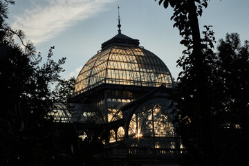 The afternoon sun shines through the panes of the domes of a crystal palace