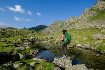 hiker on Lac Bersau, Ayous lakes tour, Pyrenees National Park, Pyrenees Atlantiques, France