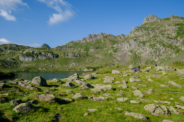 Fototapeta na wymiar hiker on Lac Bersau, Ayous lakes tour, Pyrenees National Park, Pyrenees Atlantiques, France
