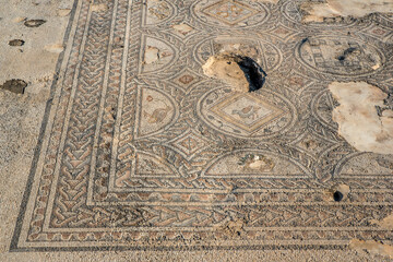 Mosaic floor of the large public building used as a market at Tzipori National Park in Israel.
