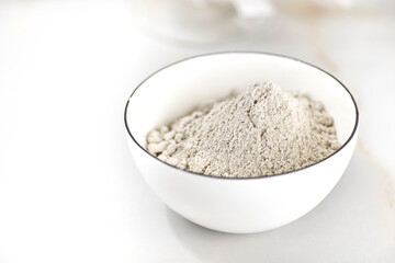 bowl of flour on a light table. selective focus