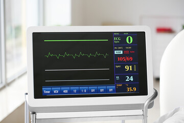 Fototapeta premium Heart rate monitor on table in clinic, closeup