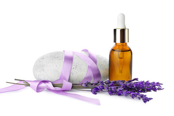 Obraz na płótnie Canvas Bottle of lavender essential oil, stone and flowers on white background