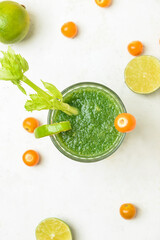 Glass of bloody Mary cocktail on light background